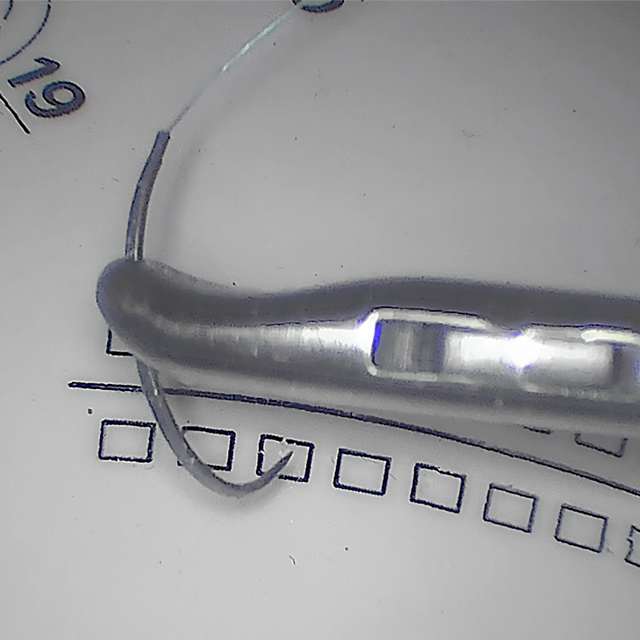 Backhand stitch, tip curved away